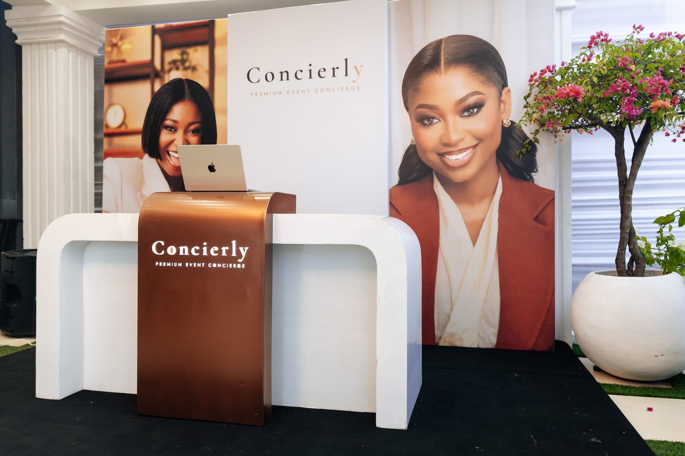 The Concierly brand backdrop at a luxury event check-in kiosk