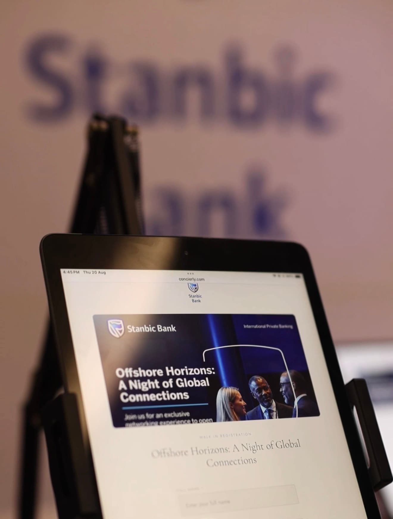 Delegate registering on a branded tablet at a Stanbic Bank event