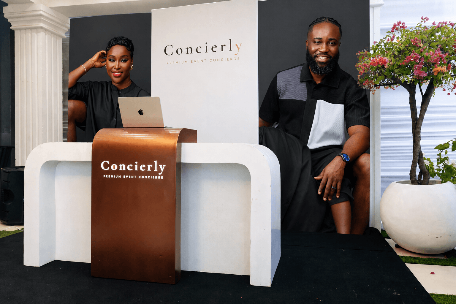 The Concierly brand backdrop at a luxury event check-in kiosk